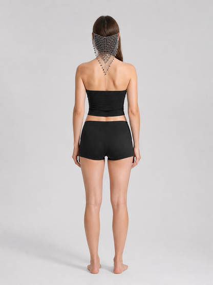 Back view of a model wearing the black and silver chain mask, showing the mesh across the head and chains hanging down the neck