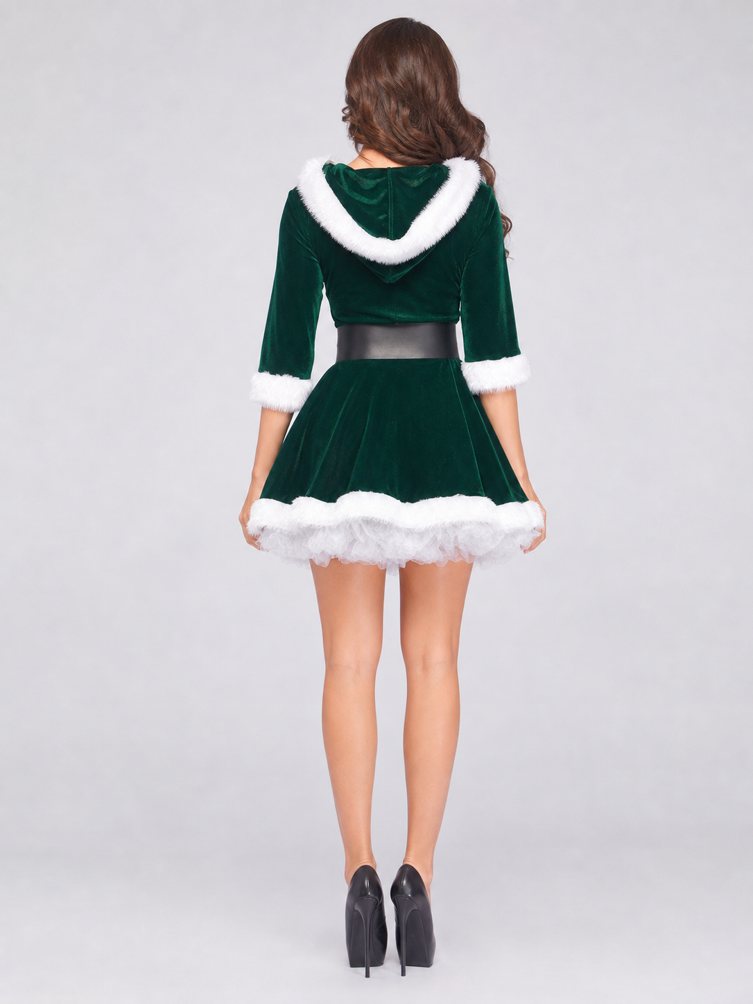 Christmas costume designed in the style of a holiday character, featuring a dark green long-sleeve dress with a full A-line skirt. The model's distinctive detail is the white faux-fur trim along the collar, cuffs, and hemline. The matching 