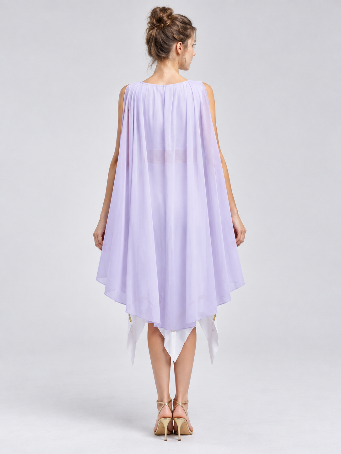 White dress with asymmetrical hem and gold trim