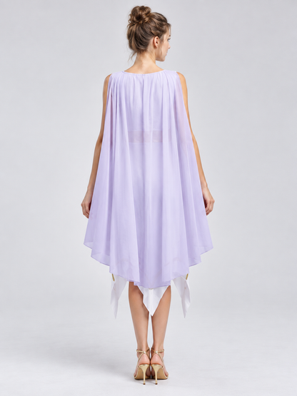 White dress with asymmetrical hem and gold trim