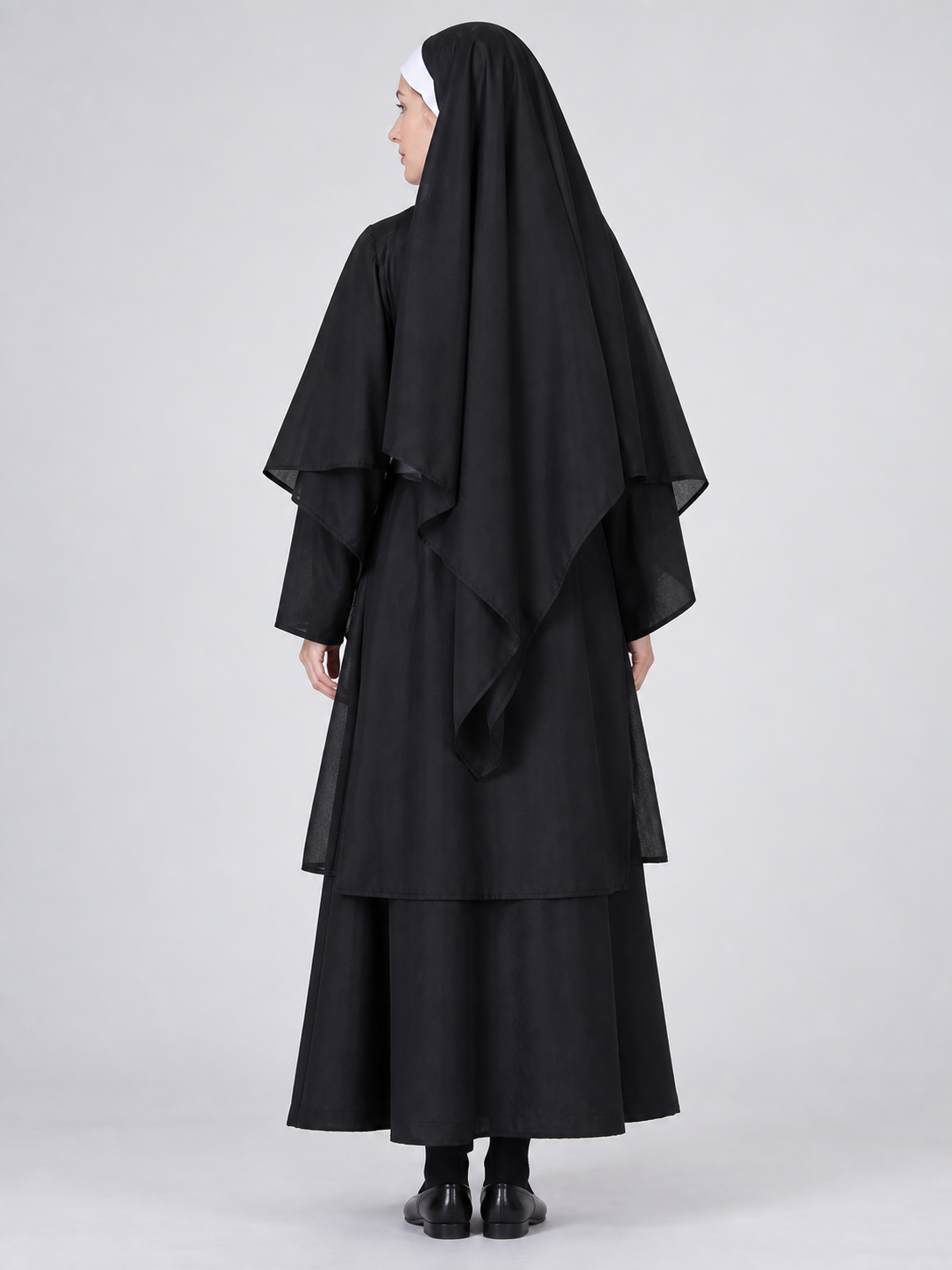 Long black and white costume with headpiece and veil