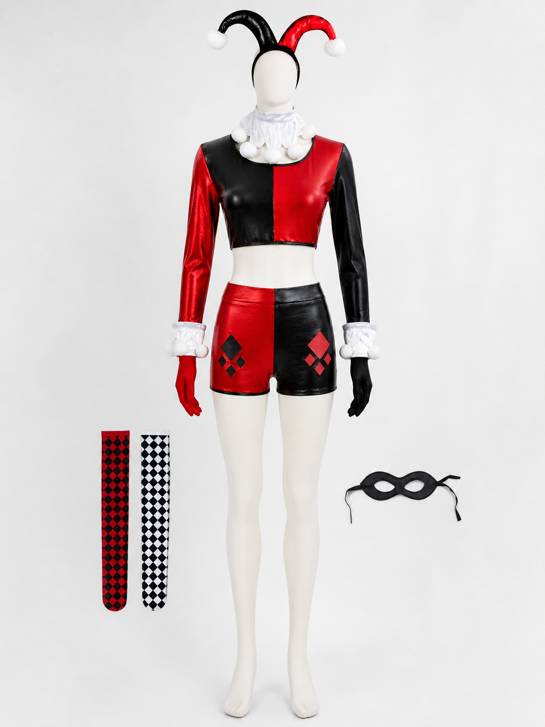 Harlequin clown crop top and shorts on a mannequin with the diamond stockings and black eye mask laid beside it