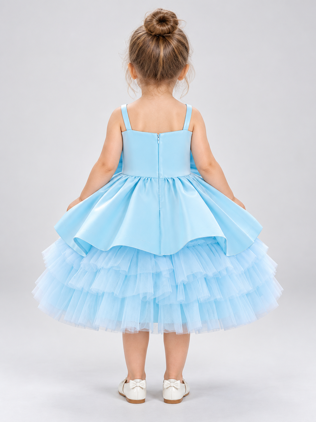 Blue children's holiday dress with a bow and a puffy skirt