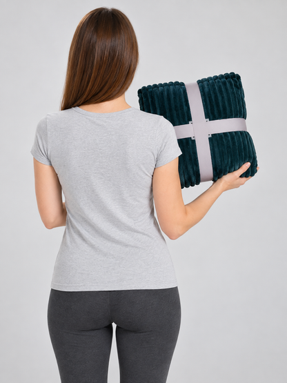 Dark green blanket with embossed longitudinal waves