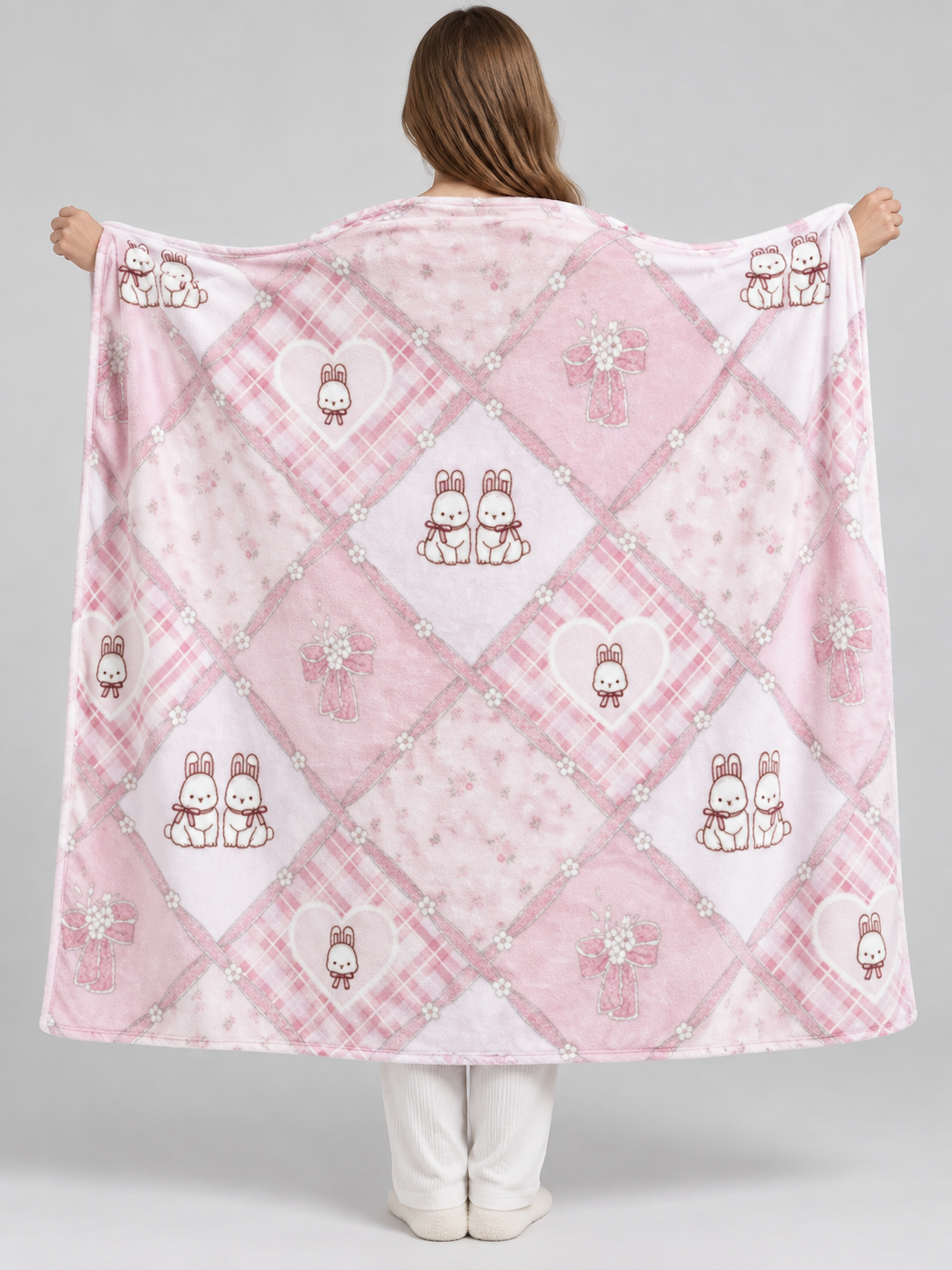 Reversible pink and white blanket with bunnies and bows