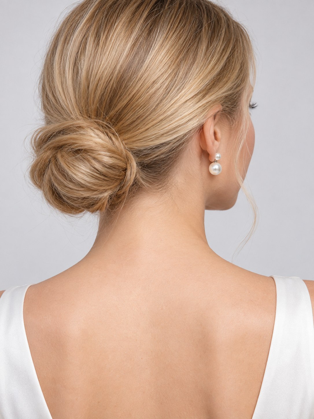 Earrings with white glossy round beads in two sizes