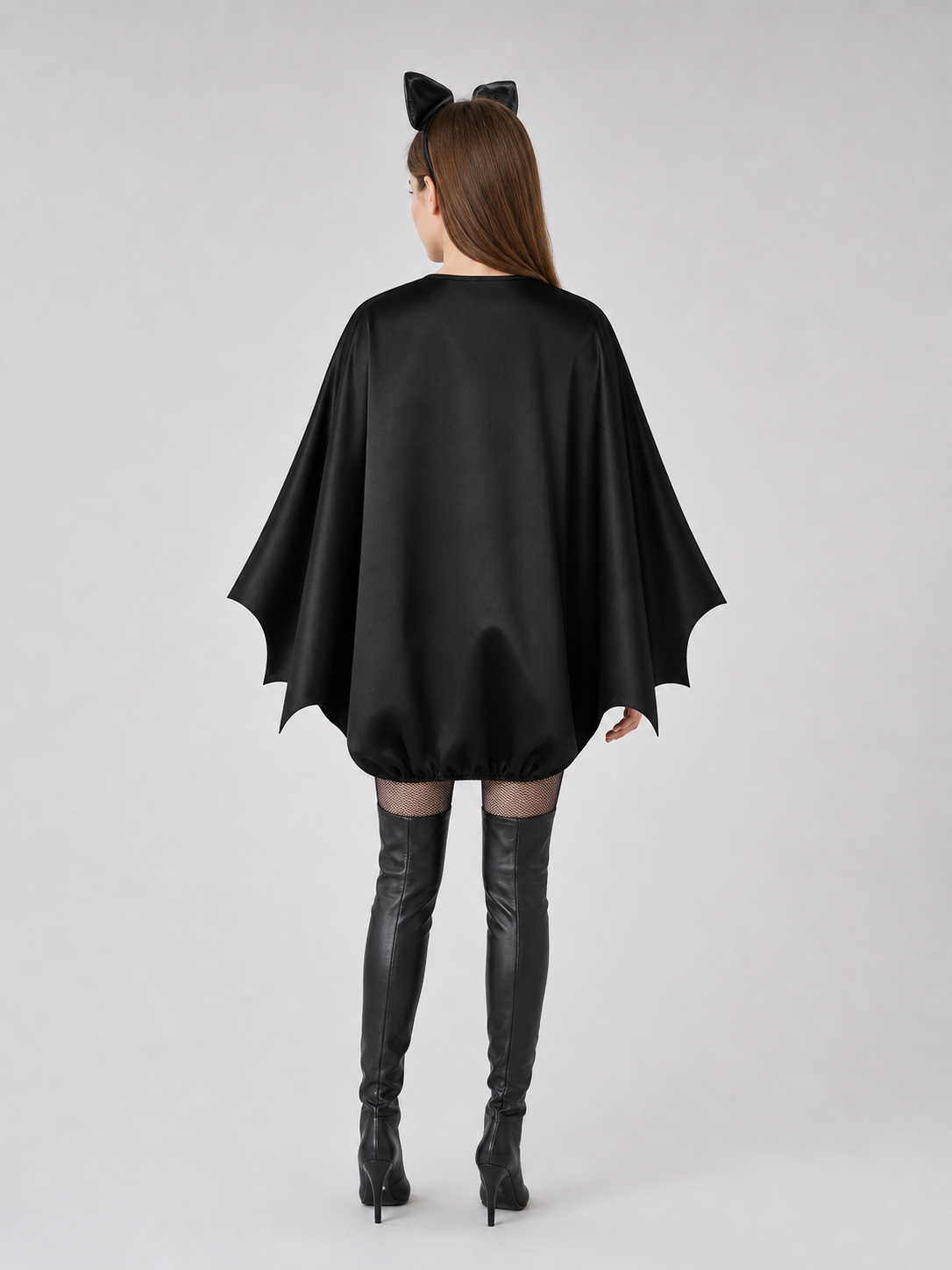 Black bat costume dress with a headband and ears for themed events. The design back view
