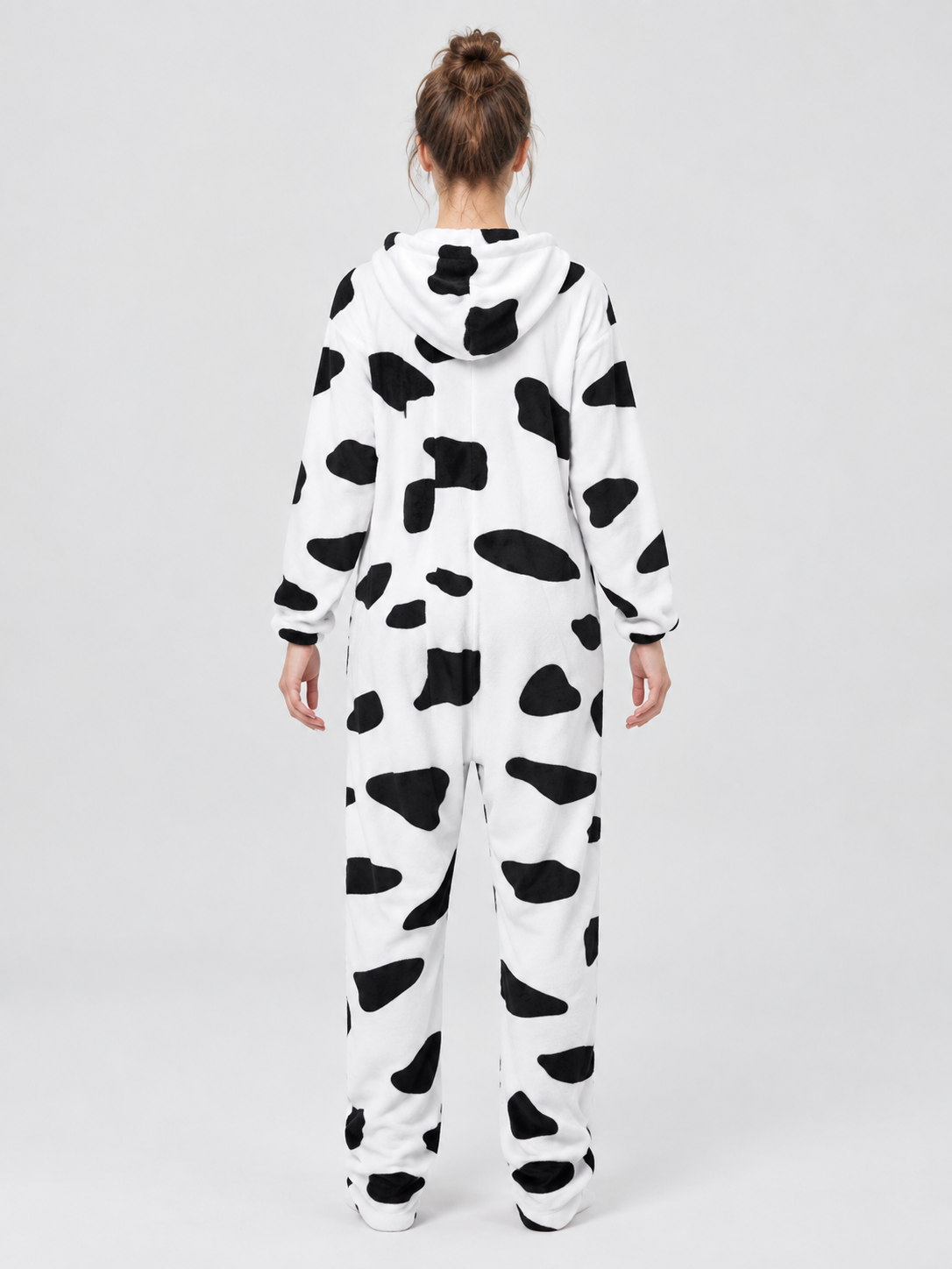 White pajama jumpsuit with black spots and a hood