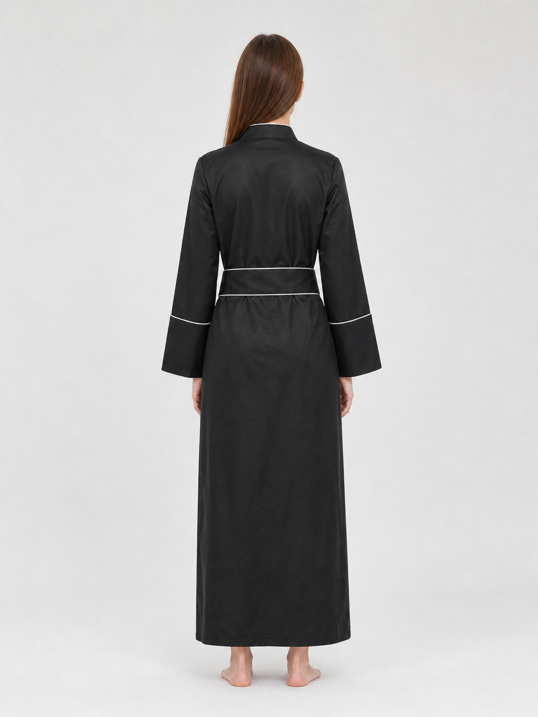 The model is designed in black and styled as a costume for cosplay, Halloween, and masquerades. It is a black cassock with a front featuring white buttons, a stand-up collar, and long sleeves. White crosses are placed on the garment: one is