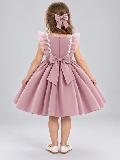 Dusty Pink Dress with a Full Skirt, Bow, and Ruffles