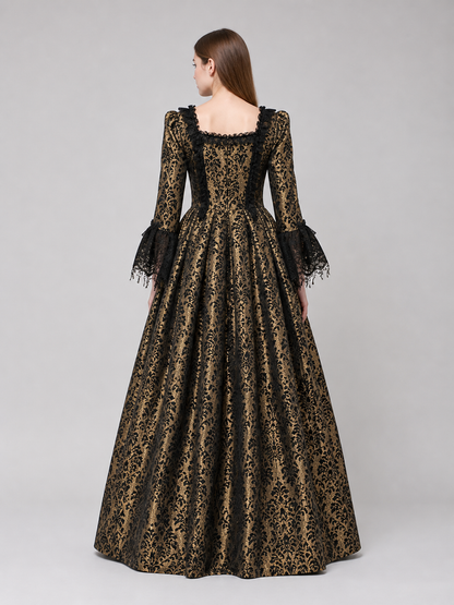 The dress is designed in a historical style with theatrical and decorative details. A golden-beige center is paired with black outer panels and damask-patterned trim, creating a striking contrast. The fitted bodice is decorated with visible