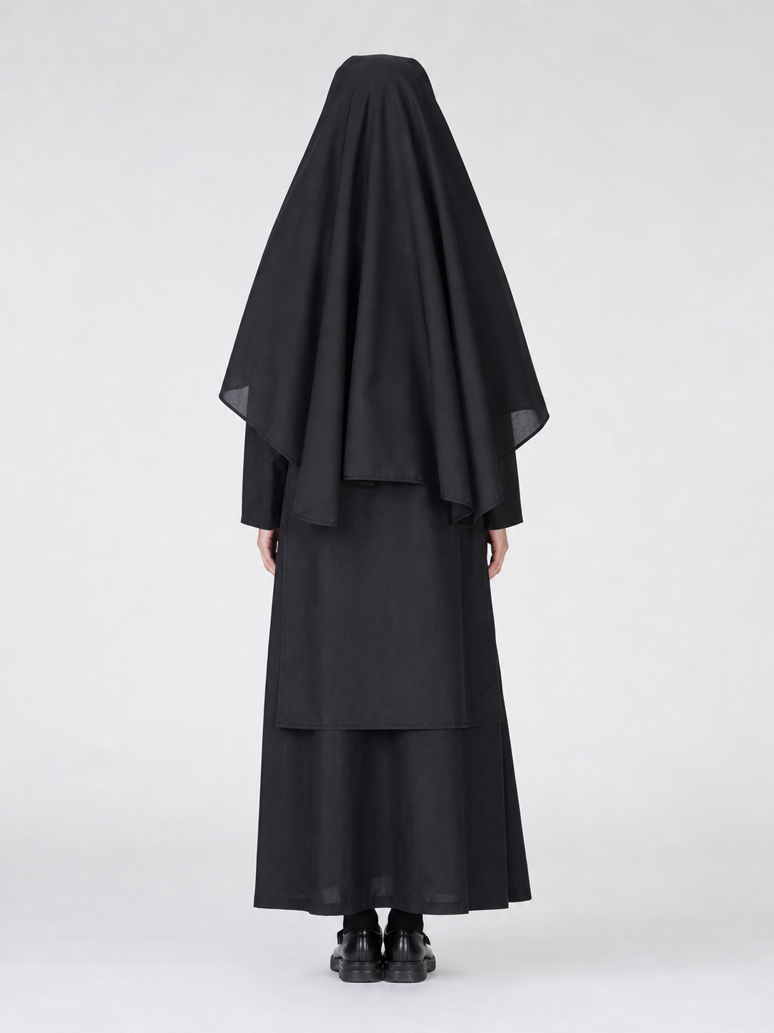 Religious-style costume with veil and cape