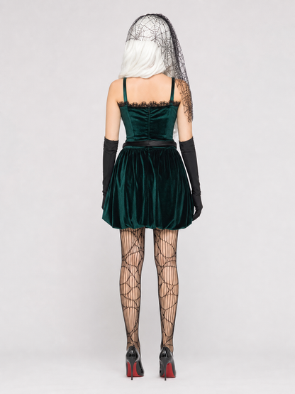 The gothic stage look is designed in deep green with a white pattern and black details. The main piece is a sleeveless dress with a fitted bodice and a short, full skirt silhouette. A circular design featuring a character profile is placed 