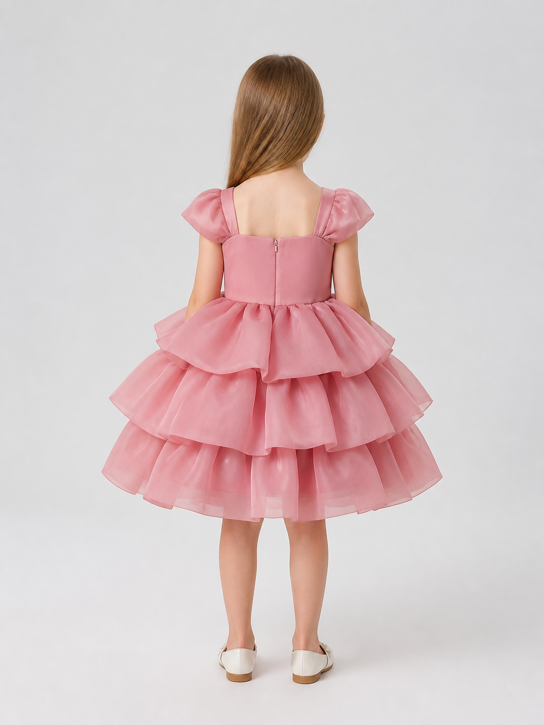 Full-skirt dress with roses for a flower girl at a wedding back view