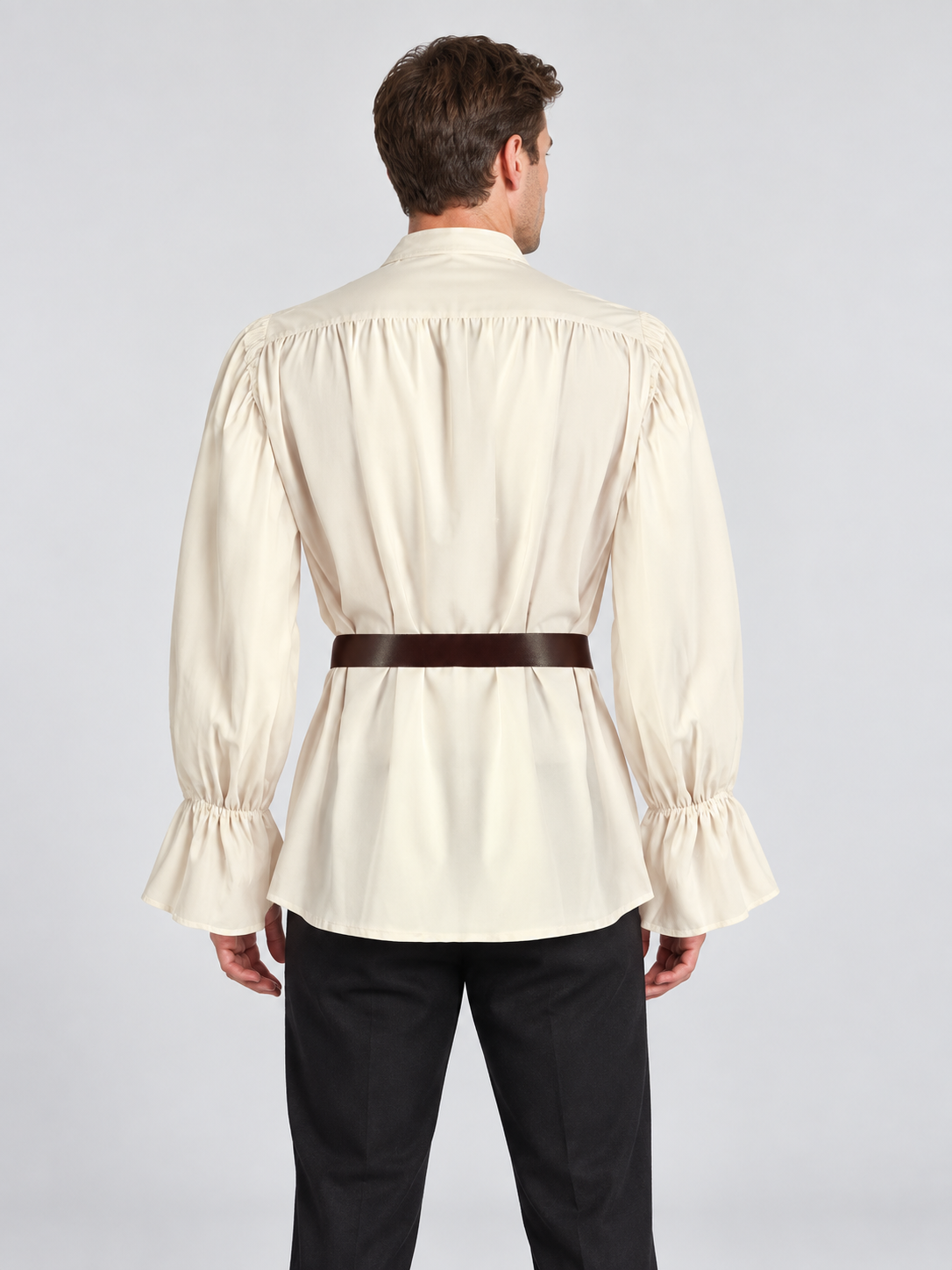 Beige ruffled shirt with puffy sleeves and a belt
