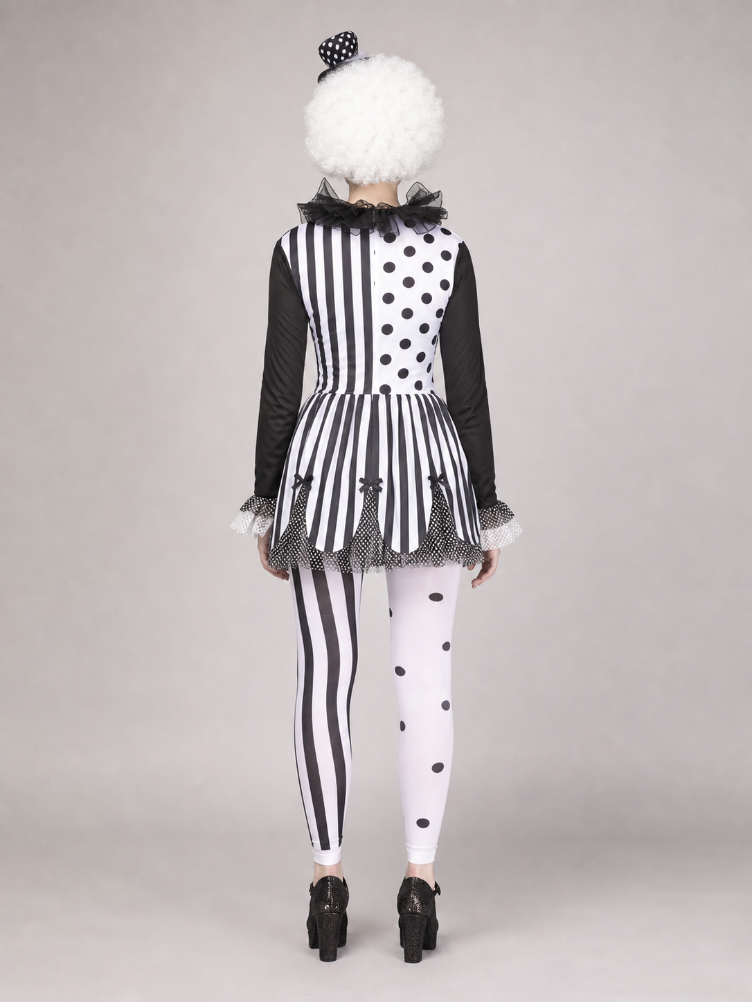 Black-and-white clown costume with a full skirt and decorative details for a Halloween look, themed party, or cosplay. The design is inspired by a circus clown: the top combines contrasting areas with black dots and vertical stripes, while 