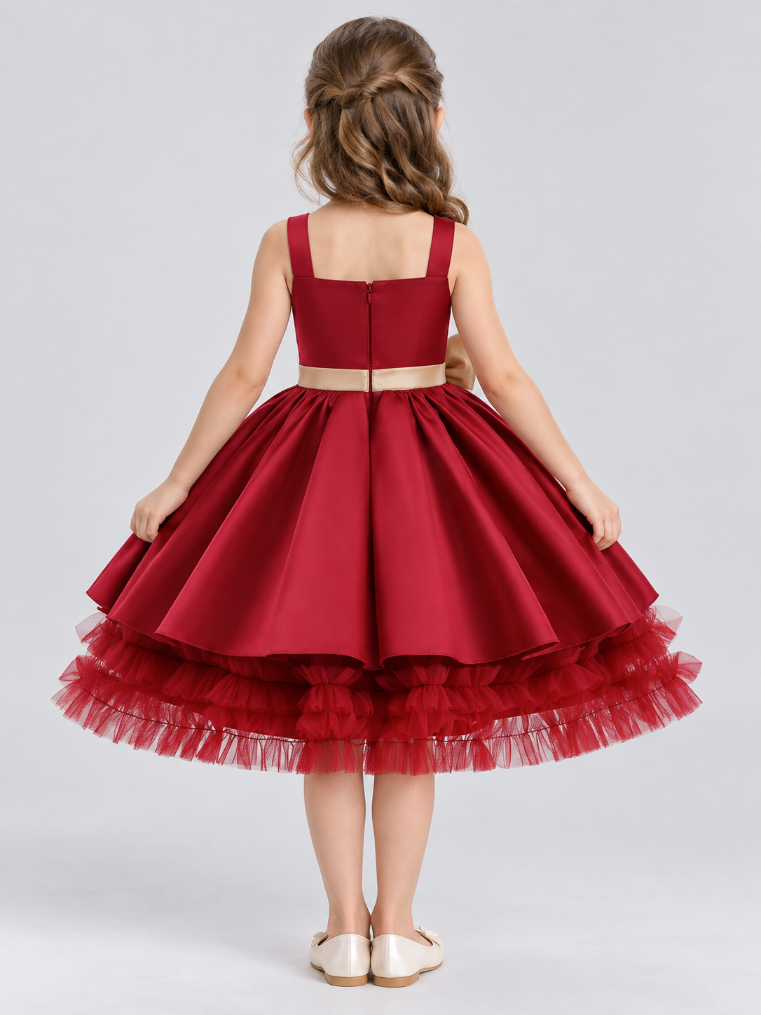 Burgundy sleeveless dress with gold bow and full skirt