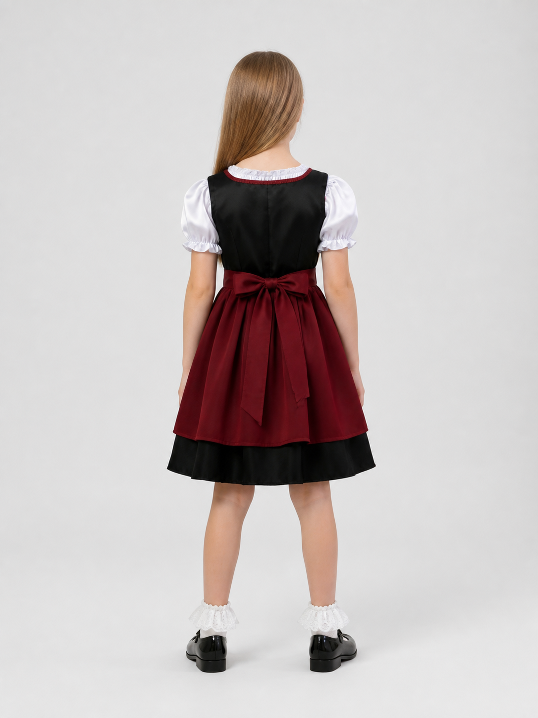 Children’s ethnic dress with a bodice and puff sleeves back view