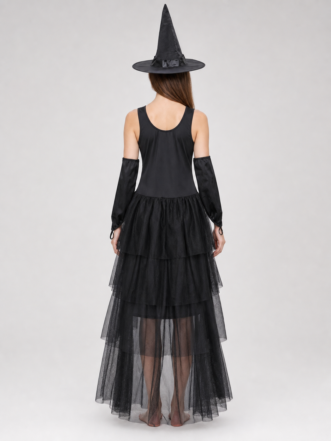 The set includes a black sleeveless dress, a pointed witch hat, separate back view