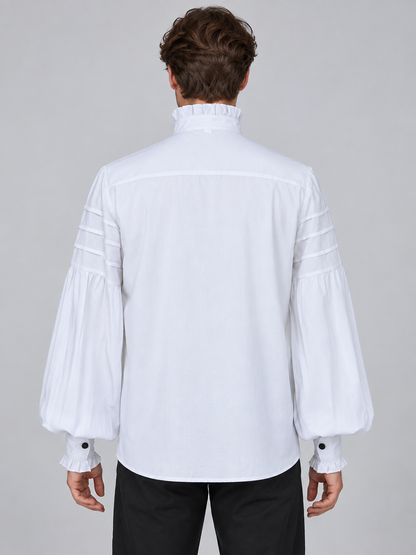 White shirt with a high collar, ruffles, and a brooch