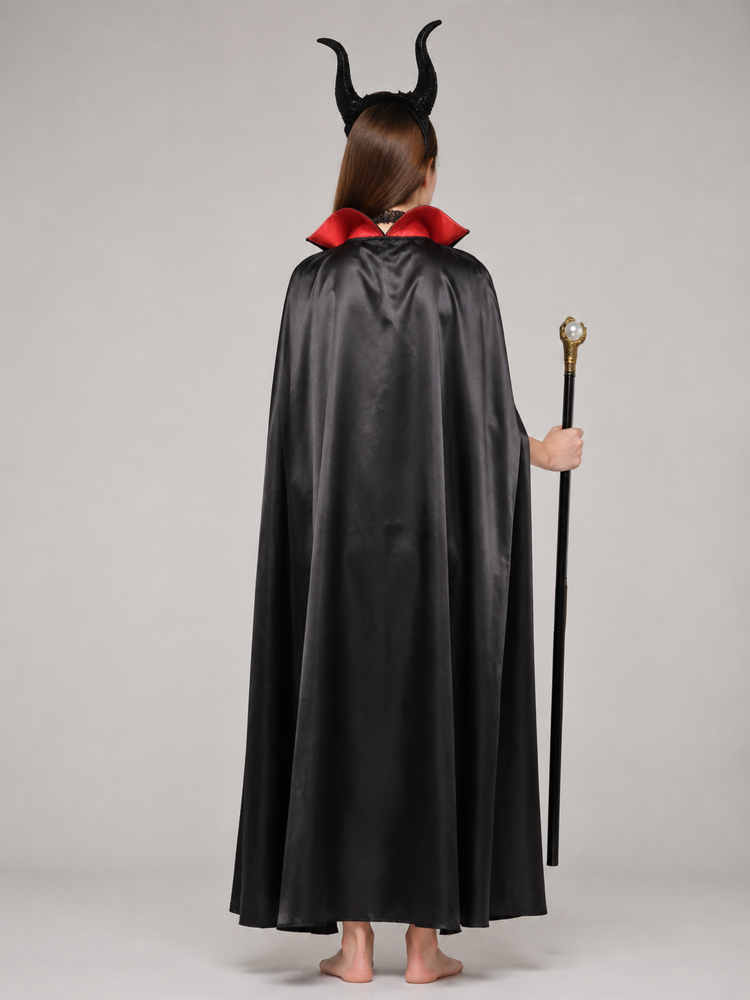 Costume set with a cape, horned headband, and wand back view