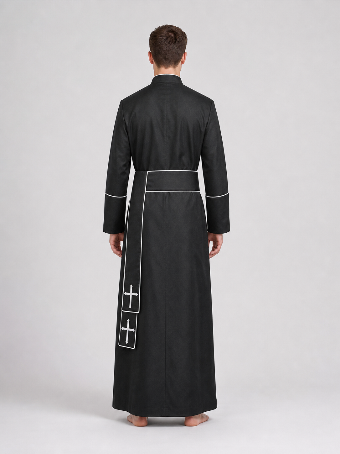 The model is designed in black and styled as a costume for cosplay, Halloween, and masquerades. It is a black cassock with a front featuring white buttons, a stand-up collar, and long sleeves. White crosses are placed on the garment: one is