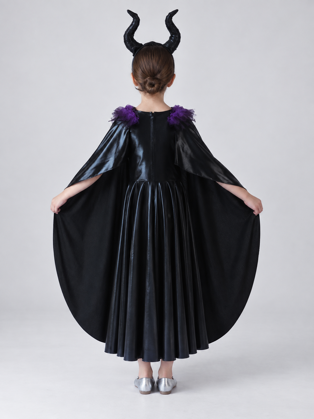 Costume: black dress, cape, headband with horns