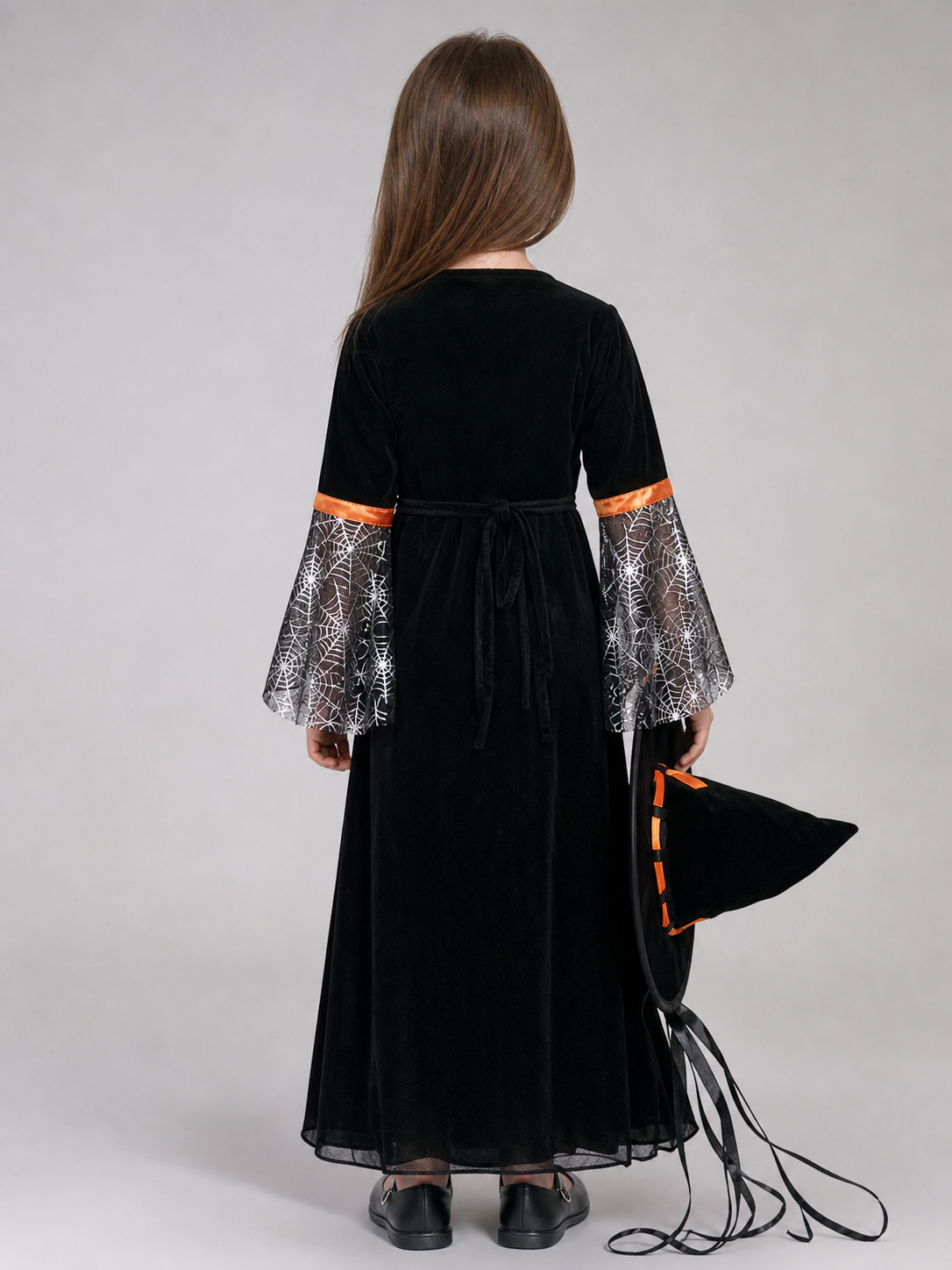 Witch-style costume set featuring a long black dress with long sleeves, a wide flared bottom, and a black pointed hat. The design uses orange, silver, and black colors. The center front of the dress features an orange decorative element, an