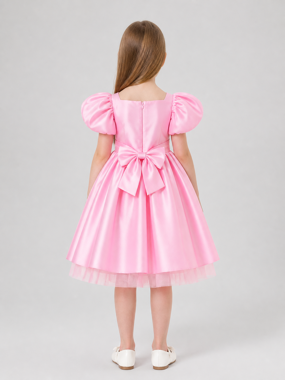 Children’s princess dress with a full skirt and large bow back view
