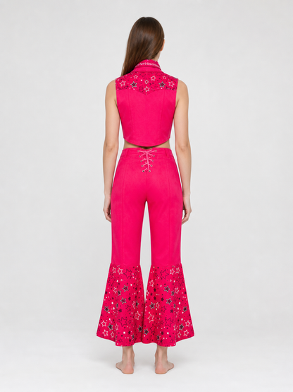 Barbie-style cosplay set consisting of two pieces: a cropped sleeveless top and flared-leg pants. The top resembles a vest with a front button closure, a decorative yoke, and a styled collar area. The pants have a high waist, front lacing, 