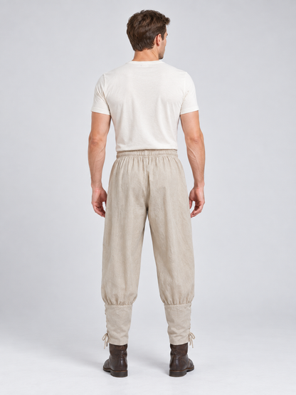 Beige long loose pants with ties at the cuffs