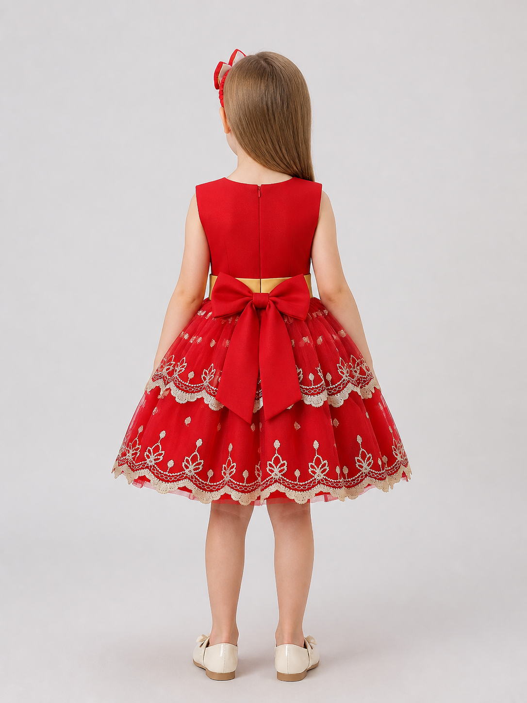 Children’s princess dress with a full skirt and gold embroidery back view
