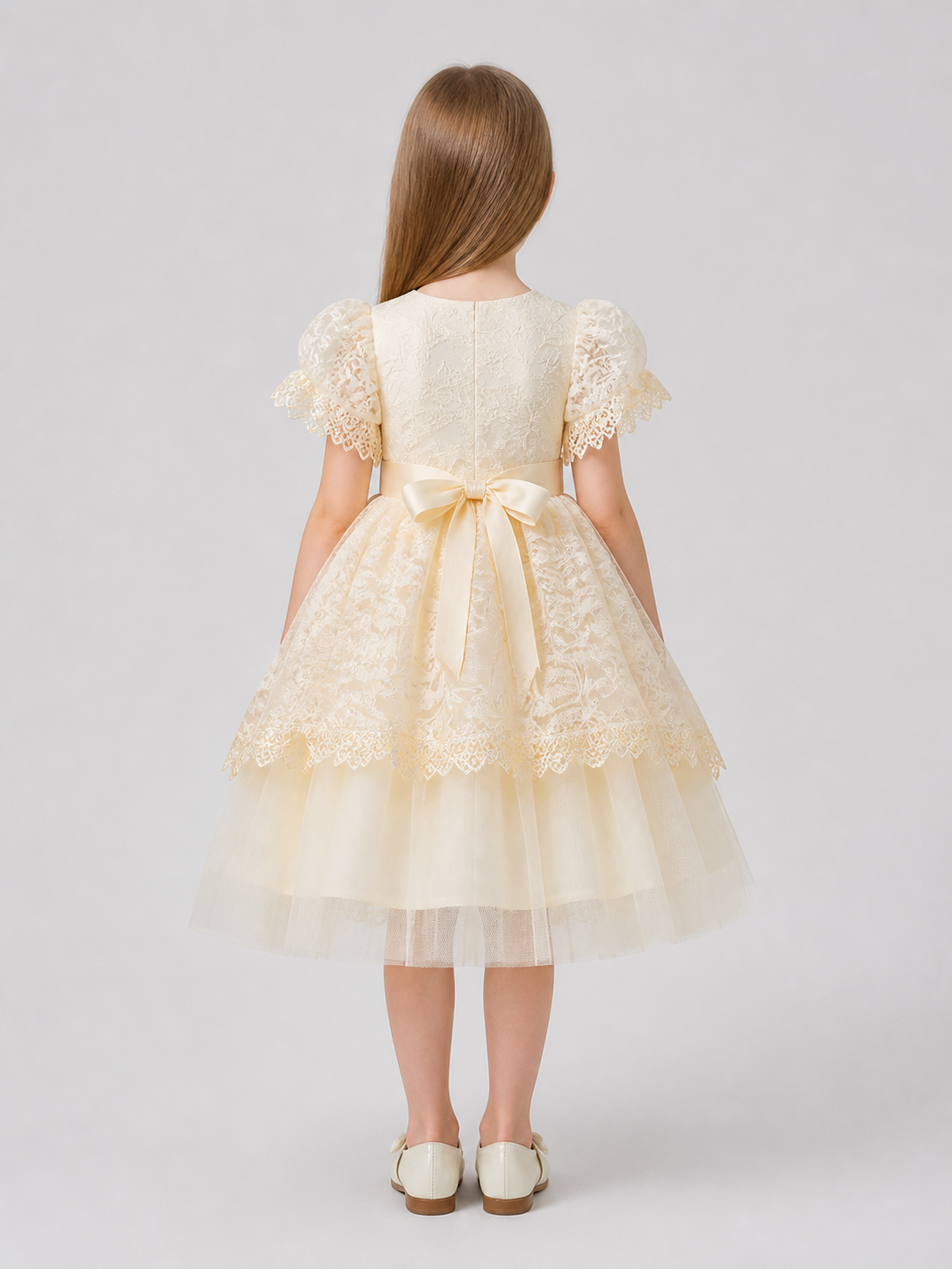 Elegant lace dress with a full skirt and bow back view