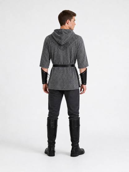 The costume is designed in the style of a medieval knight and is suitable for cosplay and stage performances. The set includes a gray hooded top with a layered front design, black pants, a belt, bracers, and greaves. The gray-and-black colo
