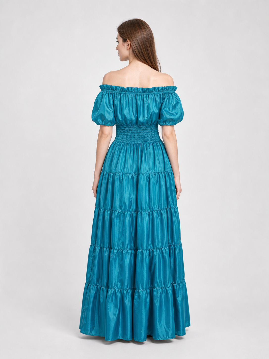 Romantic medieval-style maxi dress. This style features an off-the-shoulder neckline with a gathered elastic edge, short puff sleeves, and a fitted waist with gathering. The long floor-length skirt is made up of several tiers with soft gath