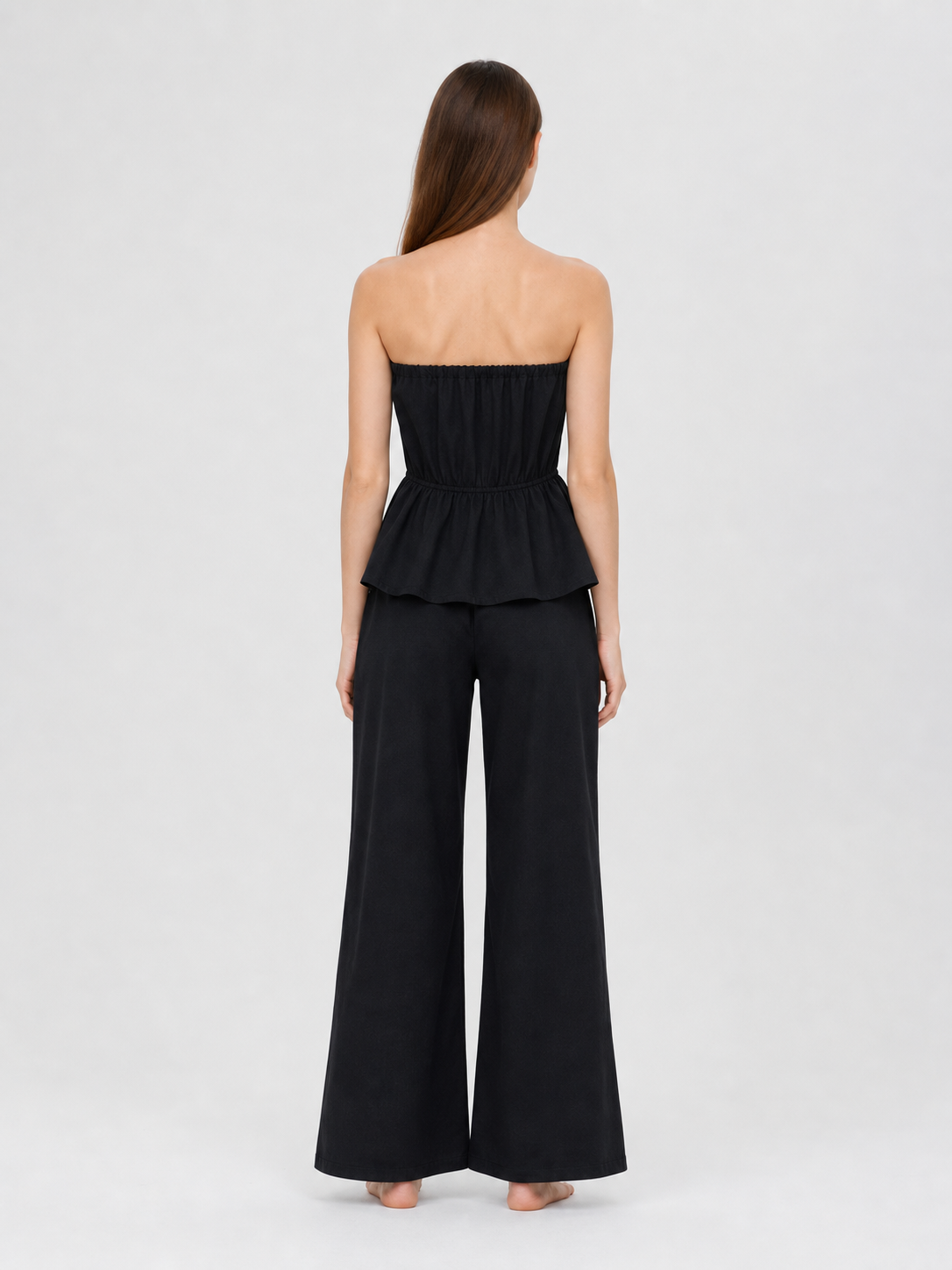Black bandeau dress with a ruched bodice