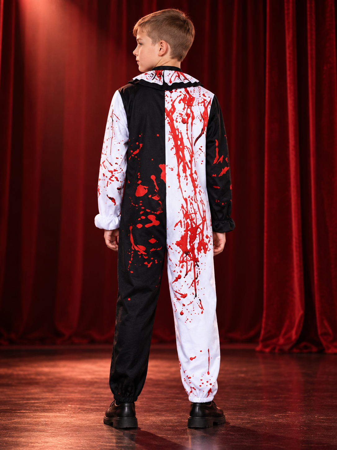 Black-and-white clown costume with red stains and pom-poms