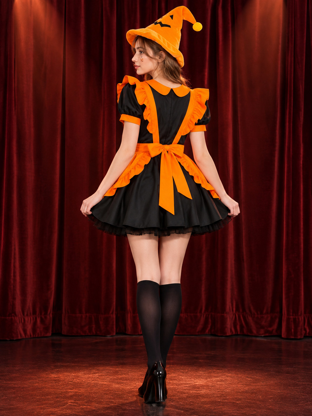 Carnival costume with black dress and orange apron