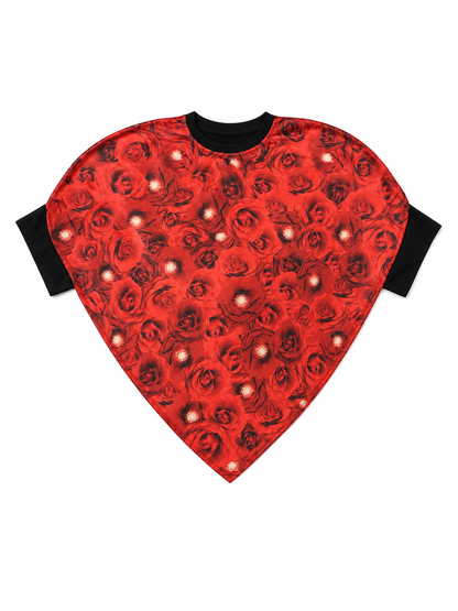 Bright heart-shaped costume with a floral print. A voluminous silhouette with a pointed lower edge and wide short sleeves that extend from the sides of the garment. The surface is decorated with an allover floral pattern reminiscent of rose