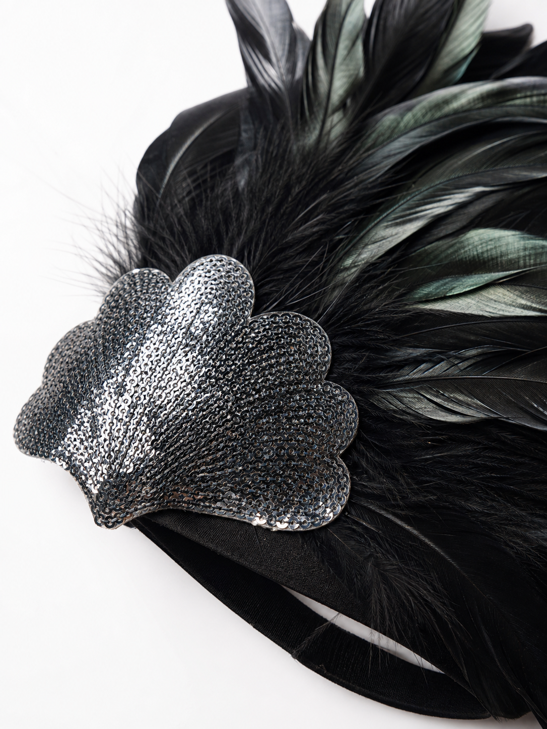 Feather carnival accessory with a silver heart