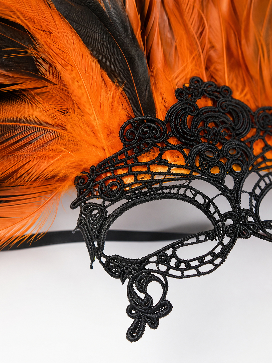 Carnival headdress with feathers and a mask