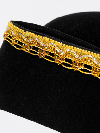 Children's black pirate tricorn hat with decorative gold trim for costume play and themed events