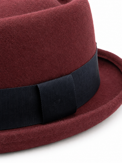 Burgundy carnival fedora hat with a dark band