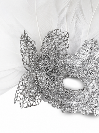 Carnival mask with white feathers and embellishments
