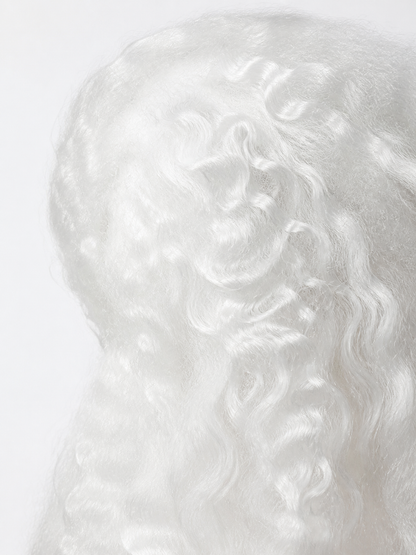 Close-up of the white wig fibers, showing soft curls and a wavy synthetic hair texture