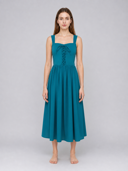 Teal dress with square neckline, wide shoulder straps, front lacing, and a full gathered skirt shown on a model