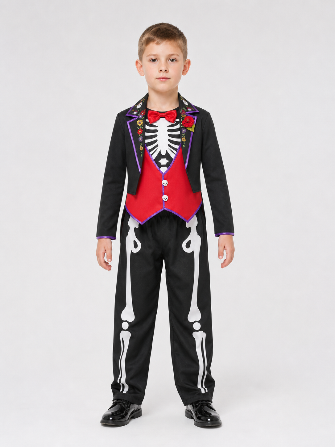 This skeleton costume is designed in the Mexican style of the Day of the Dead celebration. The outfit includes a black jacket with purple trim and floral decorations, a red vest-style front panel with decorative buttons, a red bow tie, blac