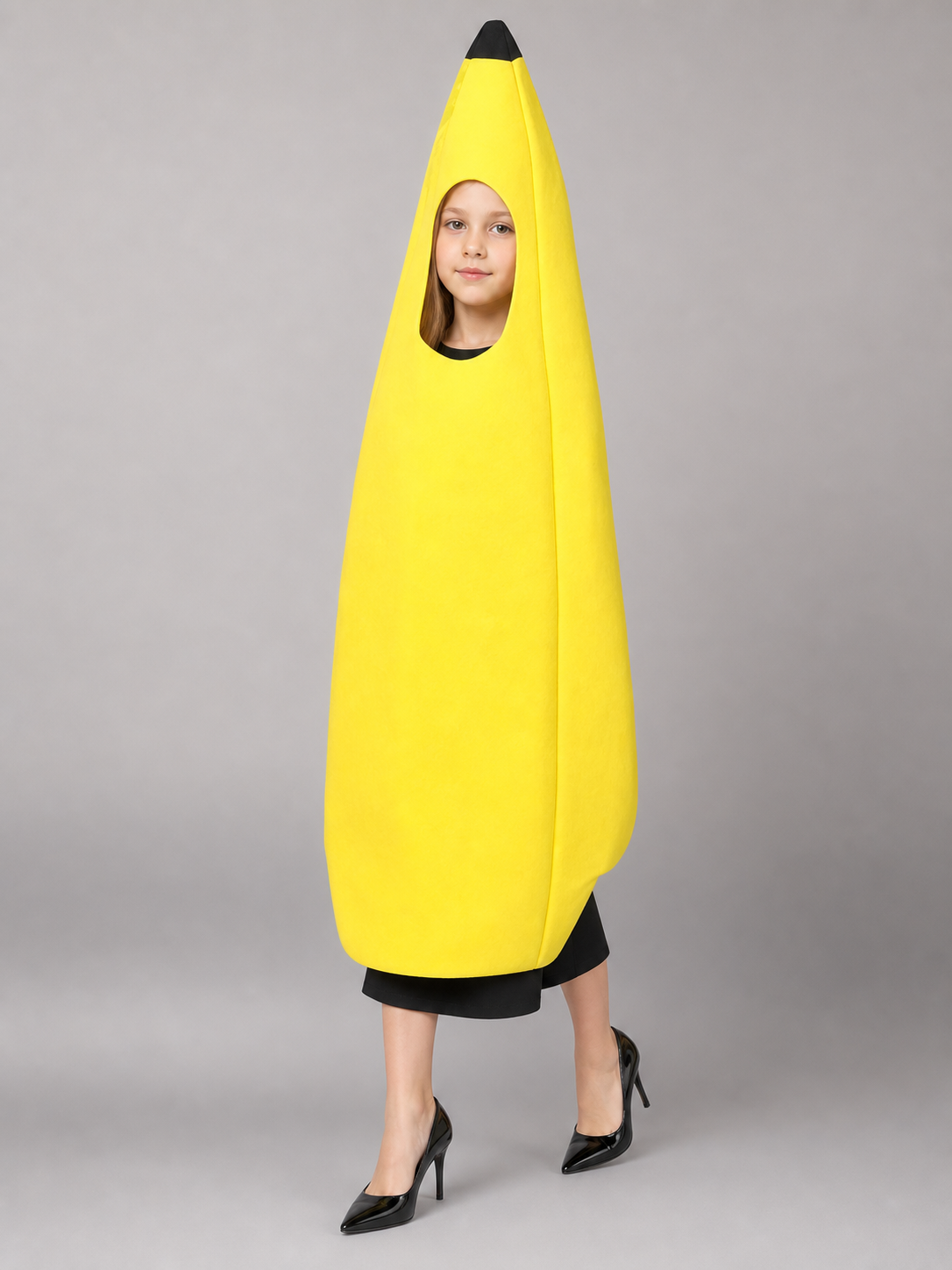Bright banana-shaped costume for dress-up and fun events. The design is a tall, elongated banana: the main color is rich yellow, and the top is finished with a black pointed tip. There is a face opening in the upper area, and the open secti