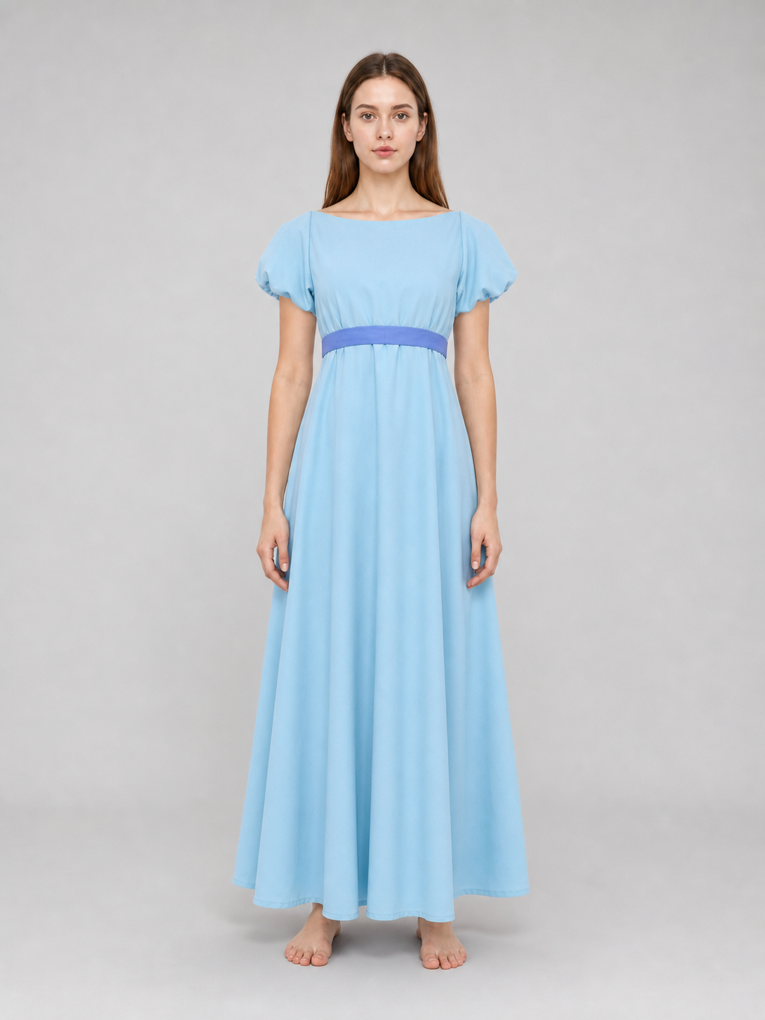 Peter Pan cosplay dress in light blue with contrasting purple-blue details. This style features a round neckline, short sleeves, and a long silhouette with a fitted upper body and a flared A-line skirt. The waist has contrasting ties that a