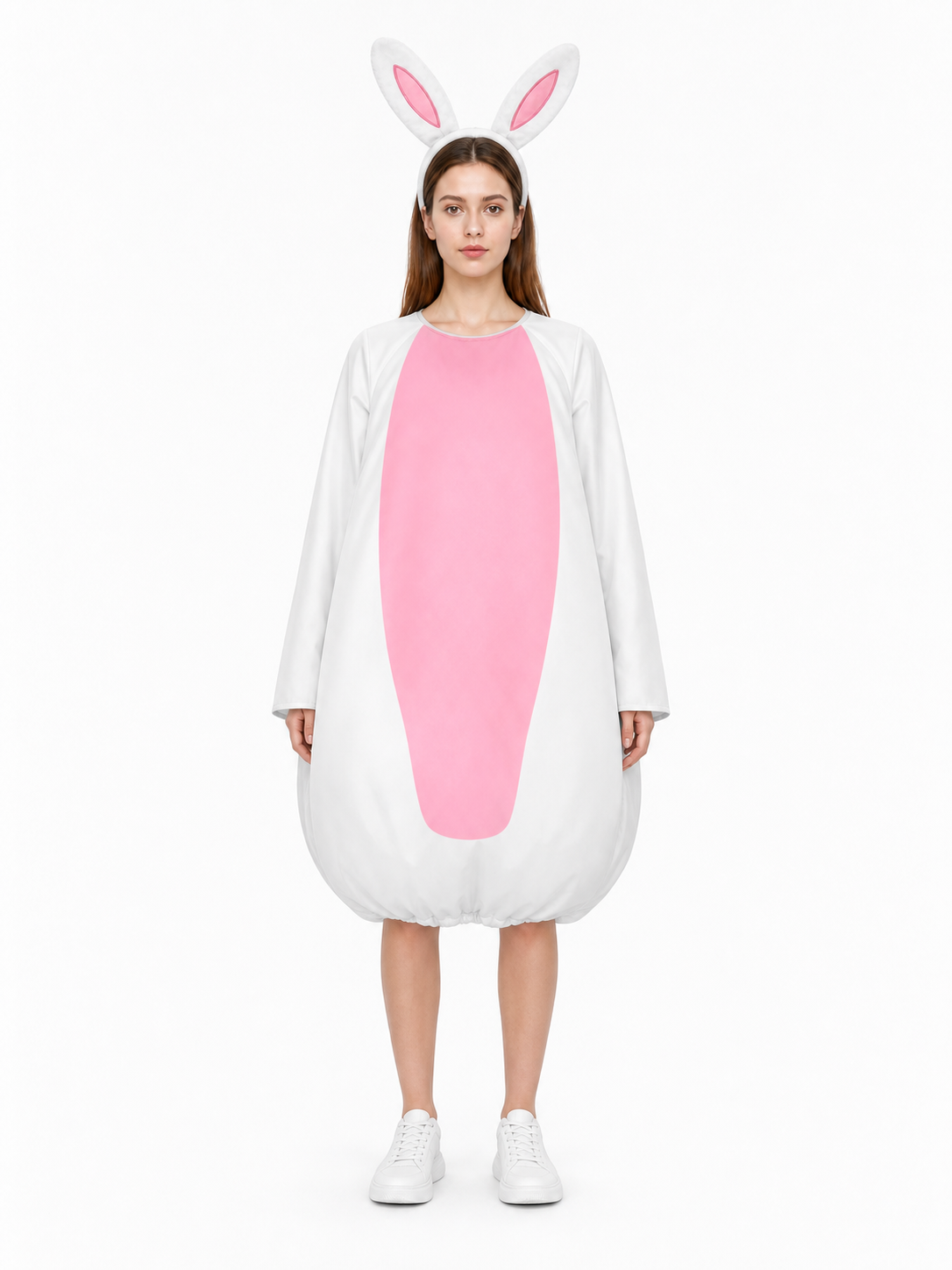 Front view of a white rabbit costume jumpsuit with a large pink oval panel and bunny ears, styled with white sneakers